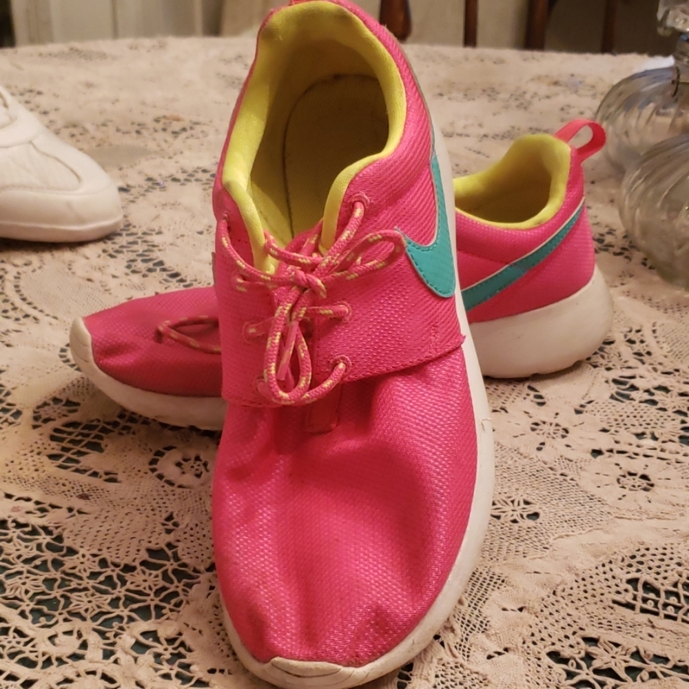 Bright pink and yellow Nike's